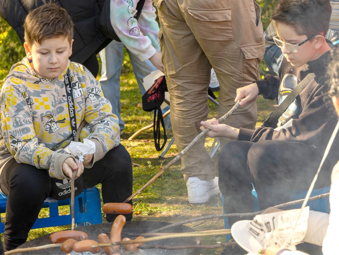 Children by the campfire.